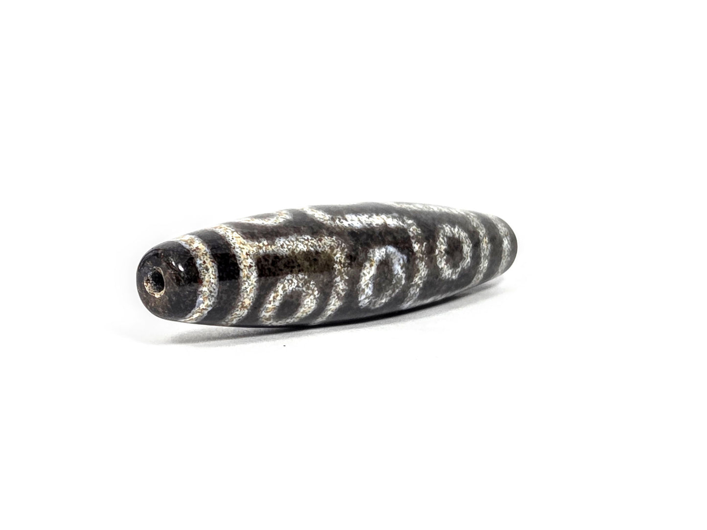 N-082326-9EBS new nine eye dzi bead drill end view two fusiform taper pitch-black agate unretouched