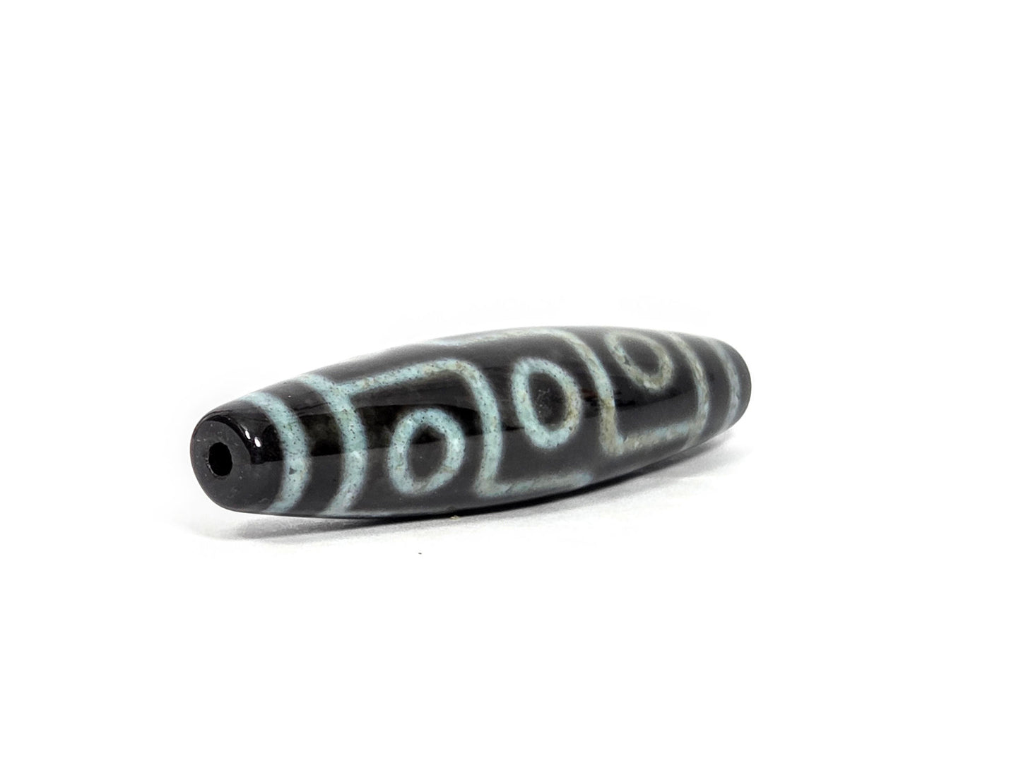 N-082326-9EBS2 new nine eye dzi bead drill end view two pitch-black glossy tip agate unretouched