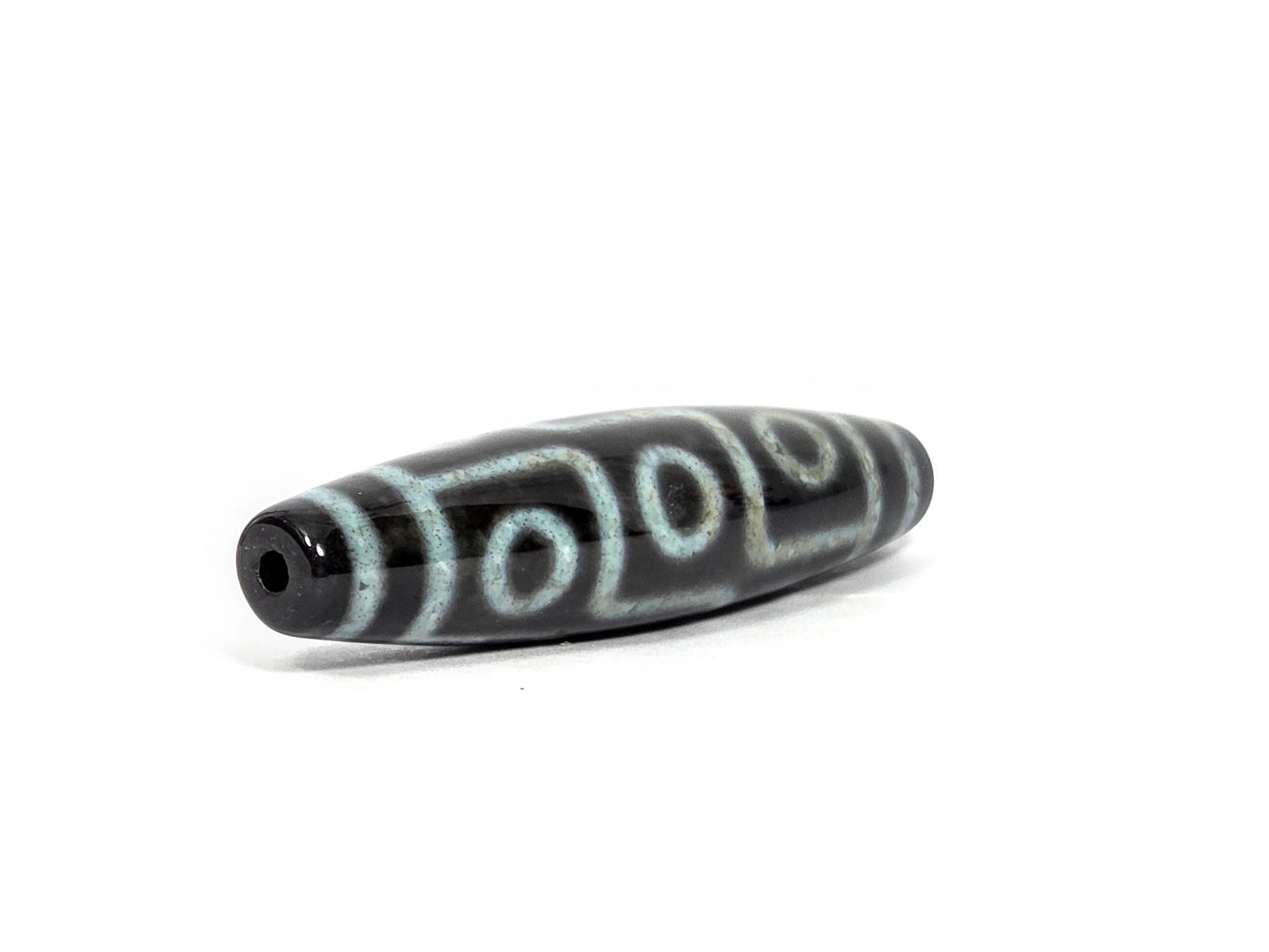 N-082326-9EBS2 new nine eye dzi bead drill end view two pitch-black glossy tip agate unretouched