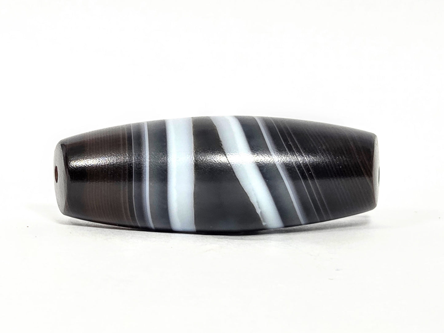 N-N-071026-1E3 natural one eye dzi banded agate full length diagonal bands both drill holes visible unretouched