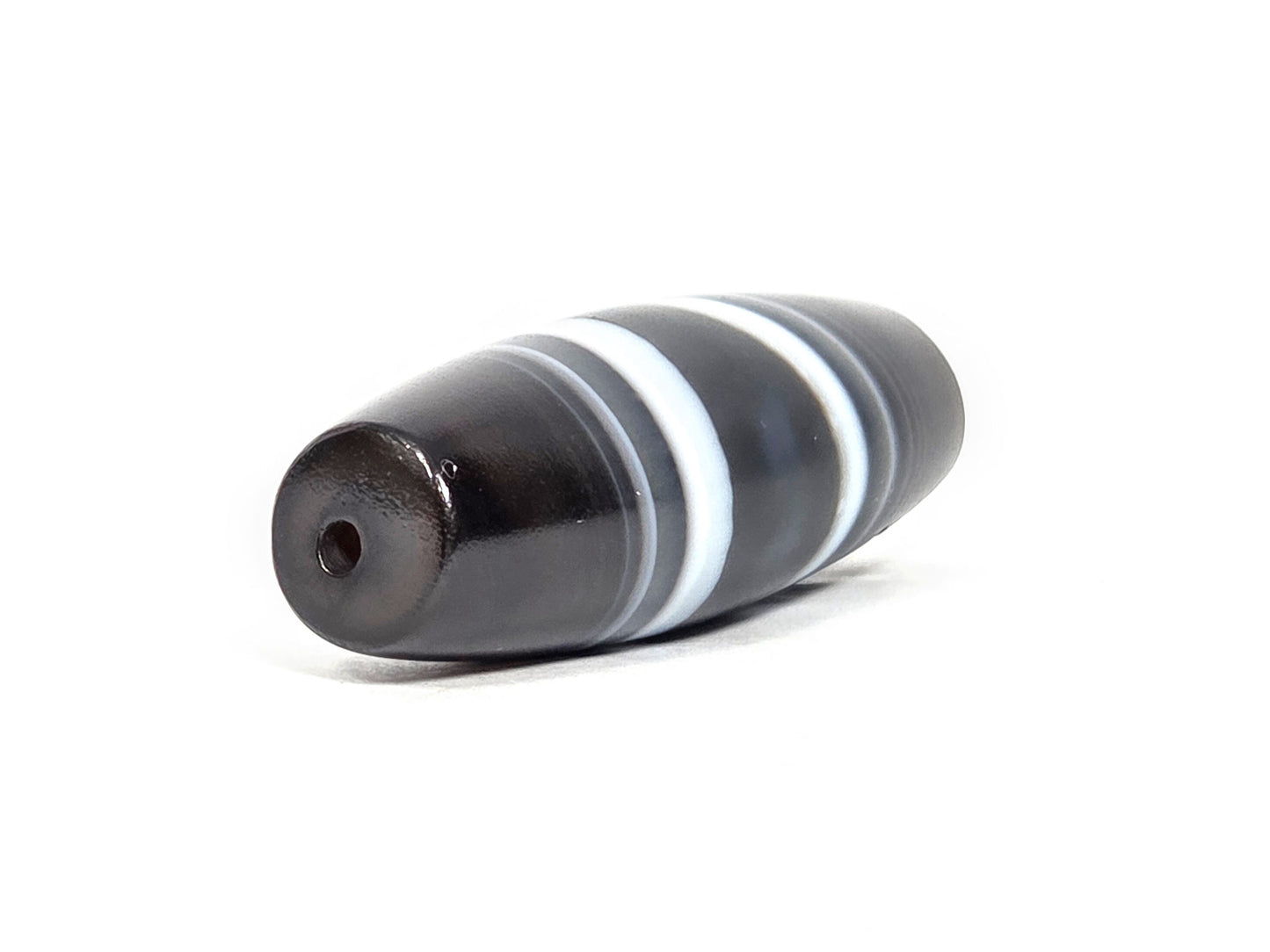 N-N-071026-1E3 natural one eye dzi angled view drill end B near-black end cap small clean hole unretouched