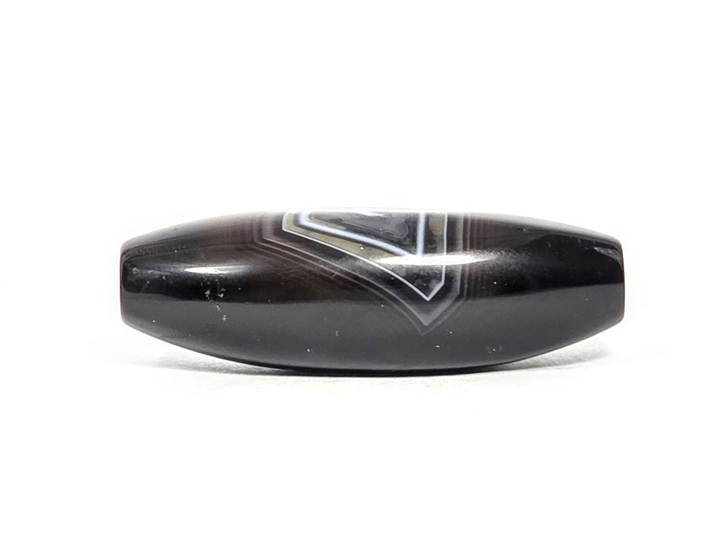 N-N-071126-1E-OLV3 rotated 90°, banding reads as broad V chevron, deep dark brown-black ground, unretouched