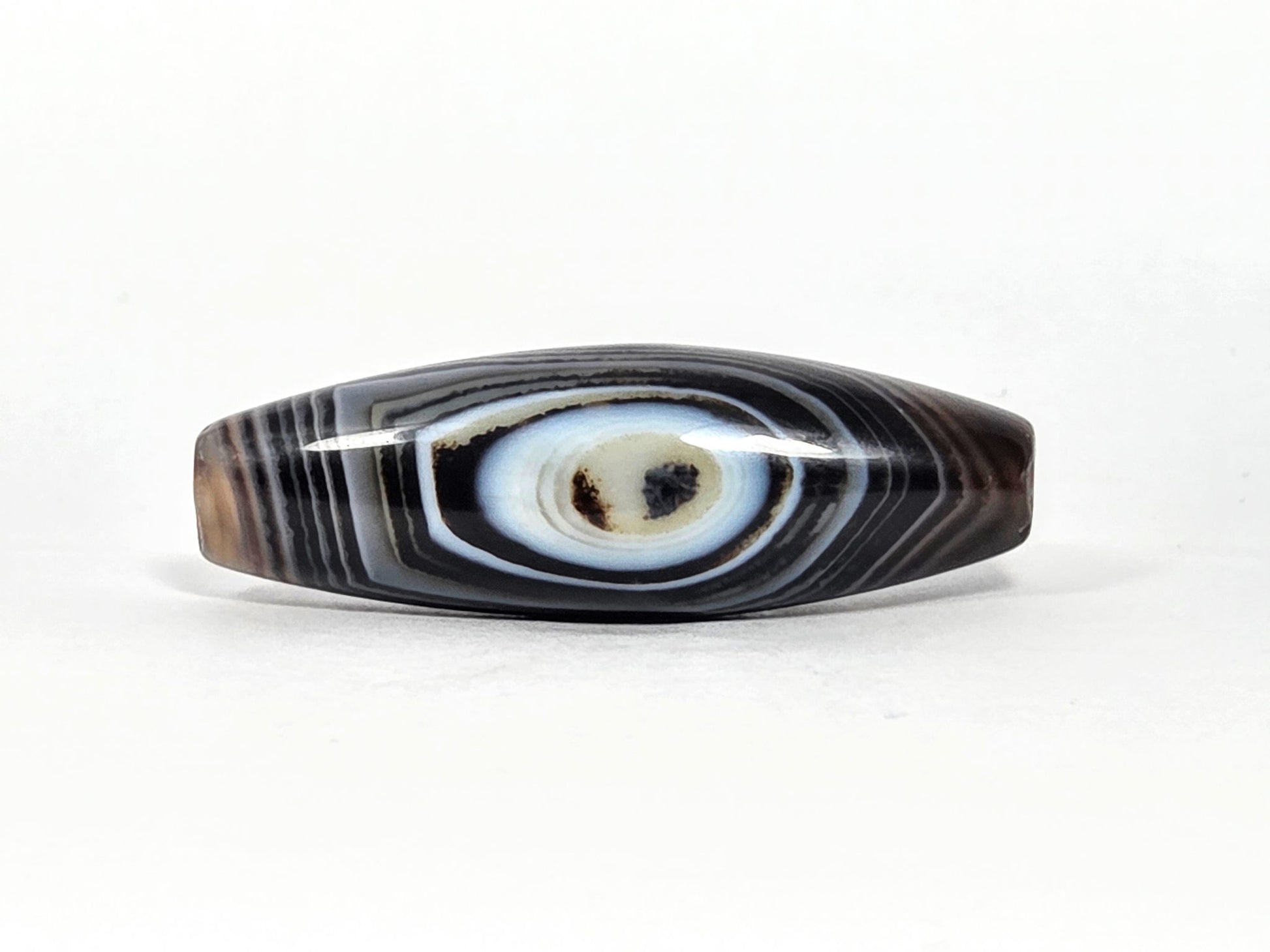 N-N-071126-1E-FCT eye face, naturally formed one eye, 44.4×14.6mm dark brown-black faceted banded agate, blue-grey eye, unretouched