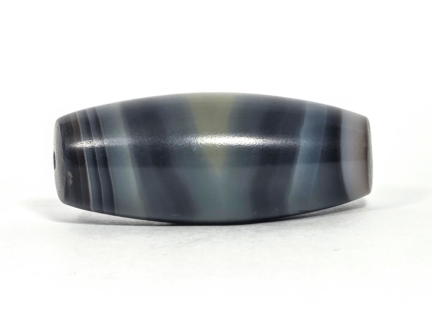 N-N-071426-1E4 natural one eye face B — cool blue-grey banding, charcoal accent lines, diamond eye visible, unretouched.