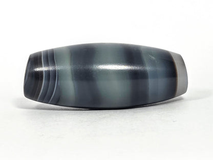 N-N-071426-1E4 natural one eye face C — steel-blue banding dominant, pale olive zone, high-gloss surface, unretouched. 