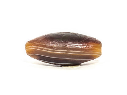 N-N-071126-1E-OLV5 upper face alternate angle, rough cortex surface, white striation line, warm reddish-brown, unretouched