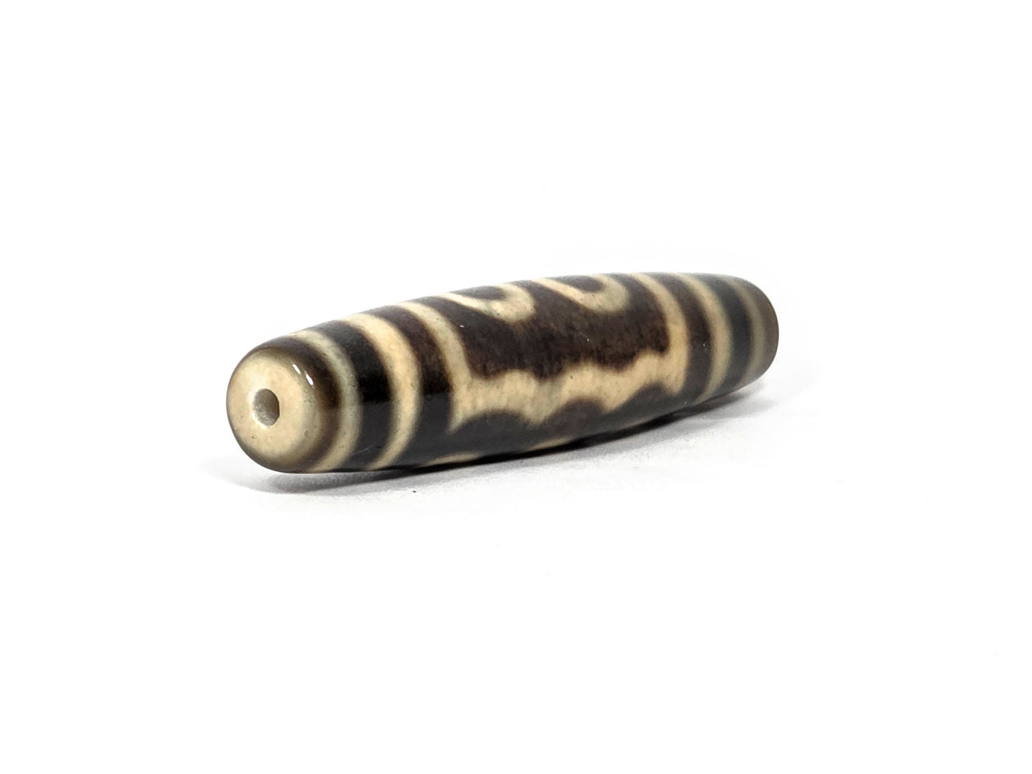 N-090126-5E new five eye dzi drill end view two honey-brown glossy tip fusiform barrel unretouched