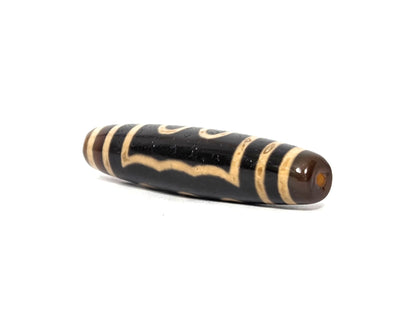 N-090126-5E2 new five eye dzi drill end view one warm dark brown cap pitch-black body unretouched