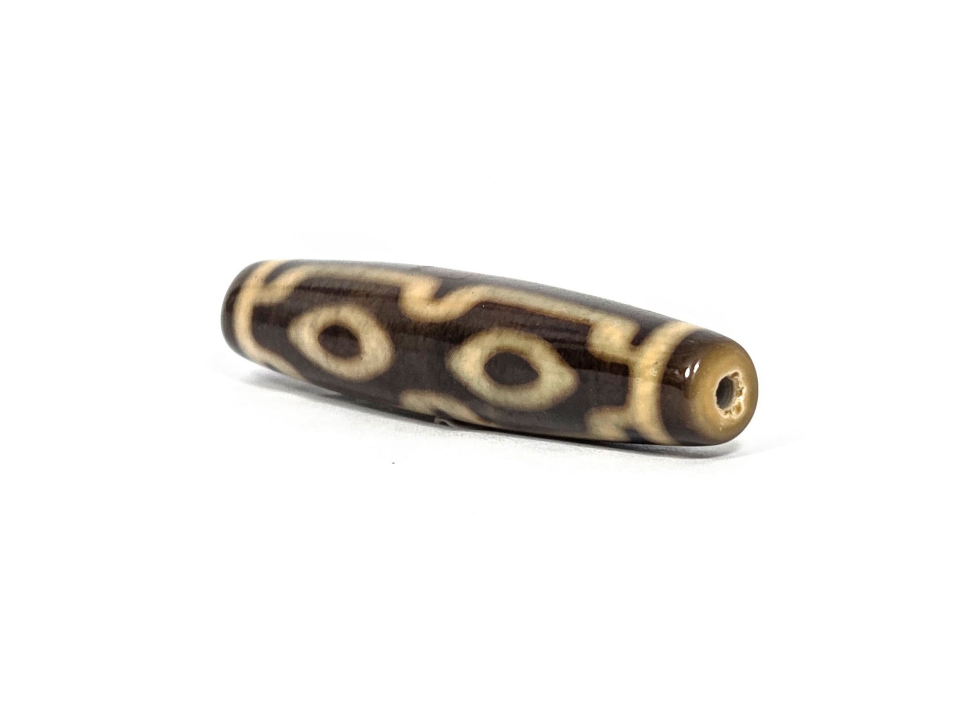 N-083126-4EV2 new four eye variant dzi drill end view one warm honey-brown tip agate unretouched