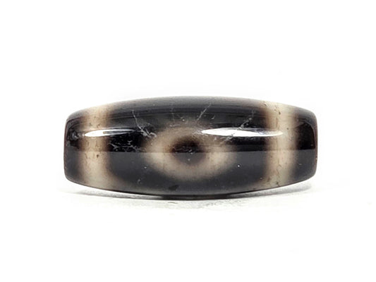 Two Eye motif N-FA-071426-2E, 28.3×11.3mm dark agate, face A — defined eye, pitch-black ground, unretouched.