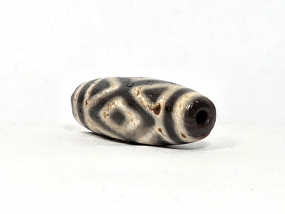 Ac-070926-3DE ancient three diamond eye tiger tooth dzi angled right drill end dark reddish-brown end cap unretouched