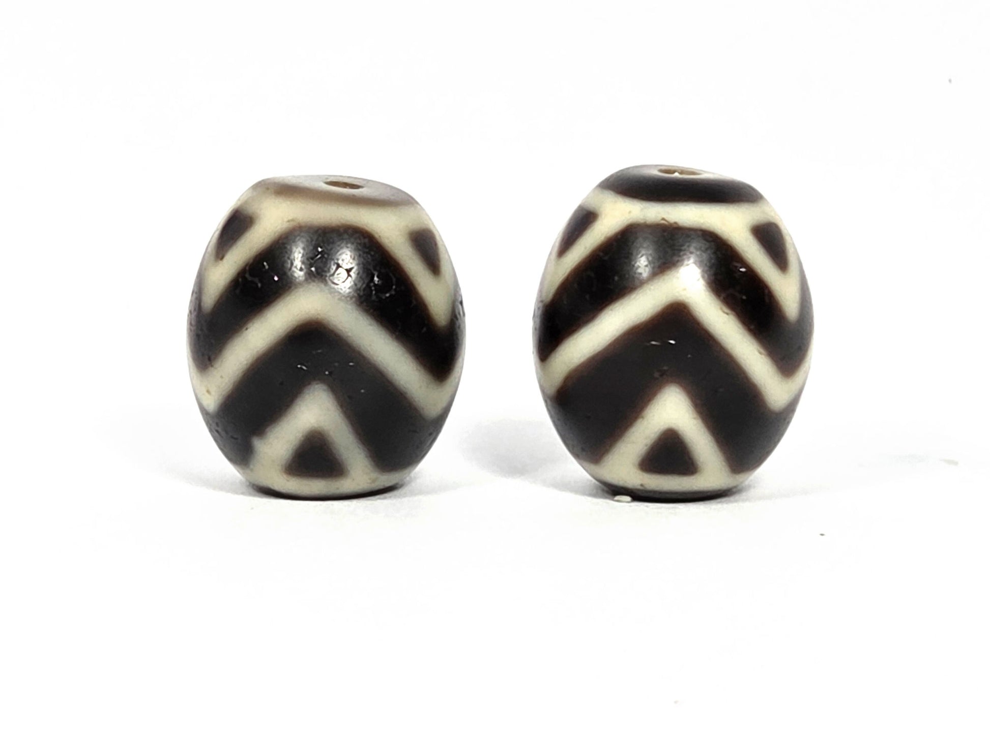 At-070626-TTW antique round Wave Tiger Tooth dzi bead pair 18.1×15.8mm & 17.5×15.6mm, second rotation front view, cream chevron and tiger tooth detail, unretouched