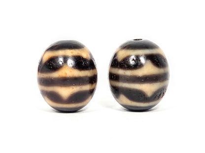 V-060426-DWP double wave round dzi pair Face B, honey-tan wave bands on dark chocolate-brown, unretouched