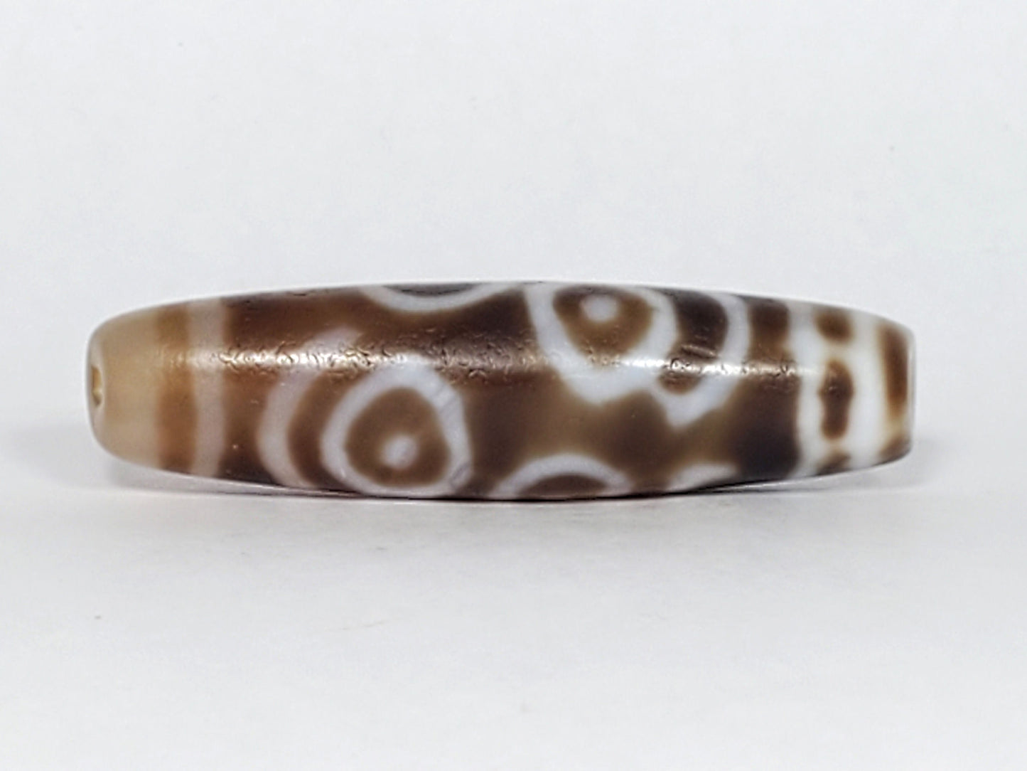 At-061926-PDEBS Face B close angle, semi-translucent glow visible, honey-tan end cap, unretouched