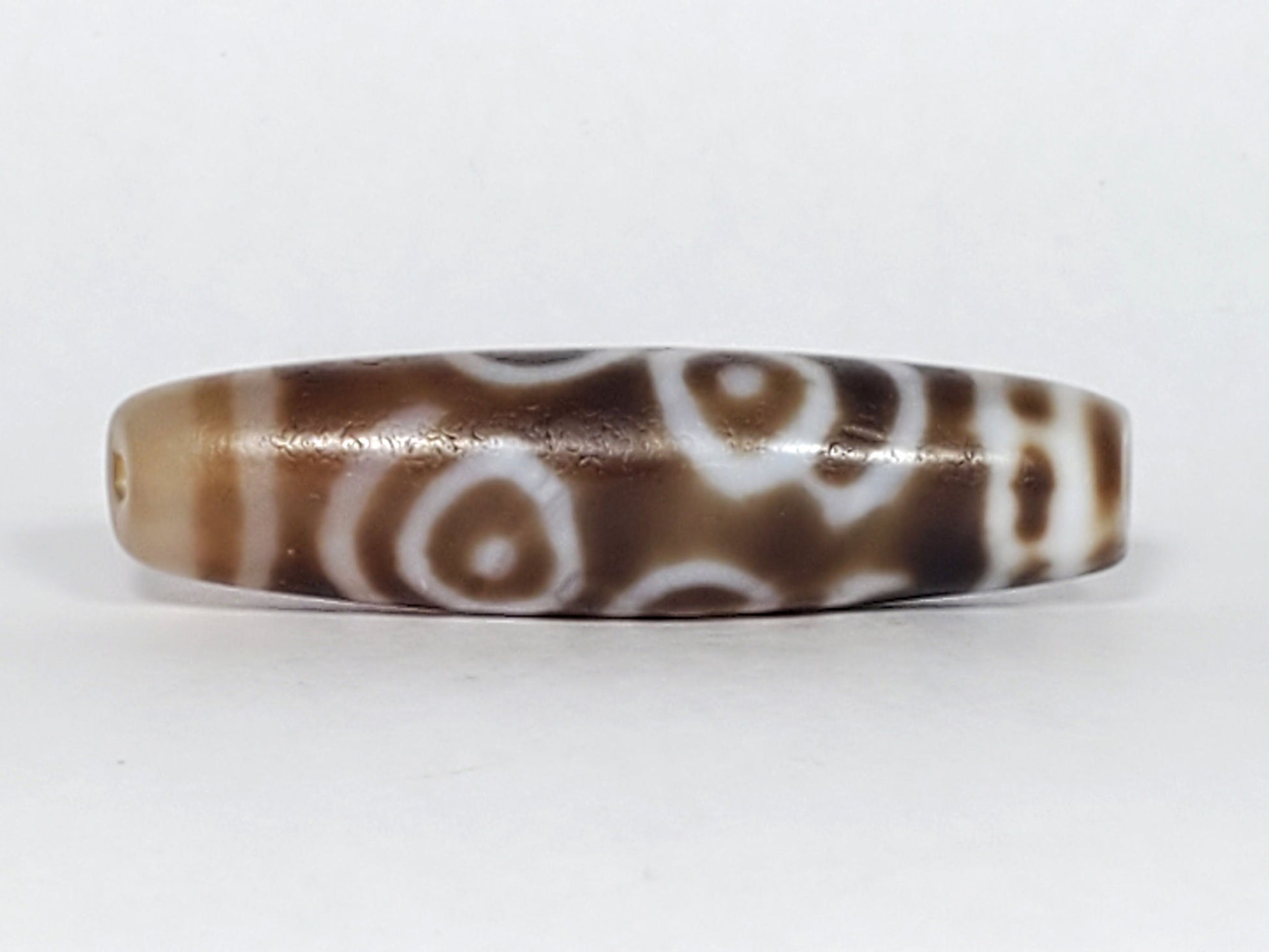 At-061926-PDEBS Face B close angle, semi-translucent glow visible, honey-tan end cap, unretouched