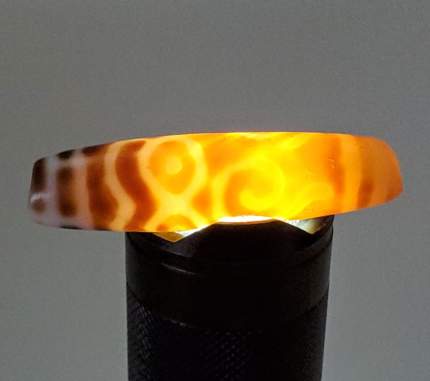At-061926-PDEBS backlit photo, golden-amber glow confirms chalcedony translucency, unretouched