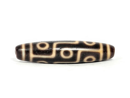 At-070626-9E antique nine eye dzi face B, deep dark brown ground, bold cream stepped eye network rotated, unretouched