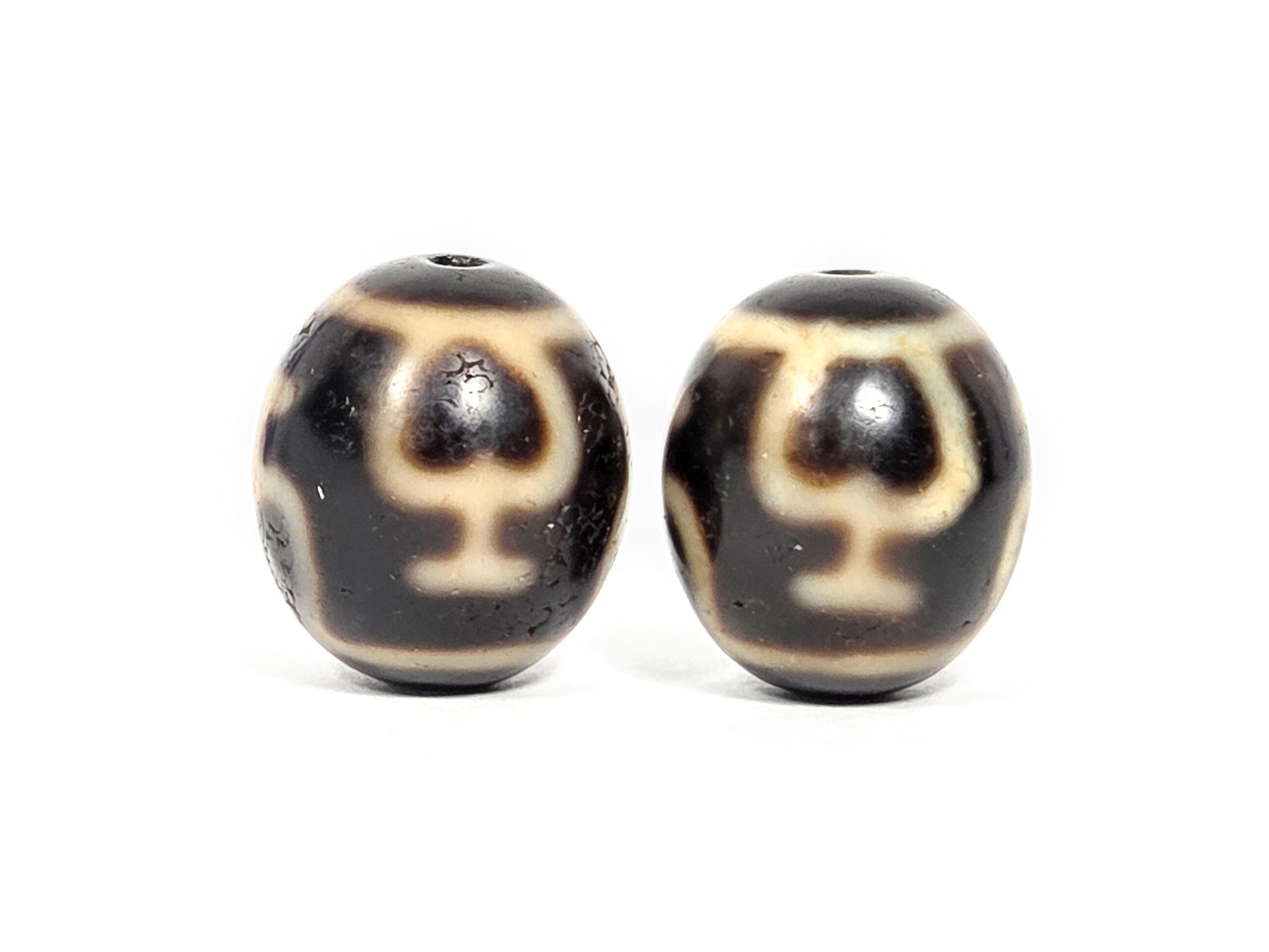Treasure Vase Variant pair V-071426-TVV face B both beads — chalice reading, dark brown agate, 1980s Taiwan, unretouched.