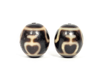 V-071426-TVV Treasure Vase pair face A alternate — vase silhouette, cream etching, dark brown agate, unretouched.