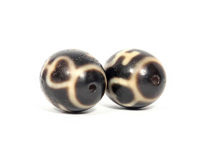 Treasure Vase Variant pair V-071426-TVV drill-end angle A — cream network wrapping equator, dark brown agate, unretouched. 