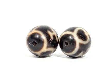 V-071426-TVV Treasure Vase pair end angle B — cream wrap, both drill openings visible, dark agate, unretouched.