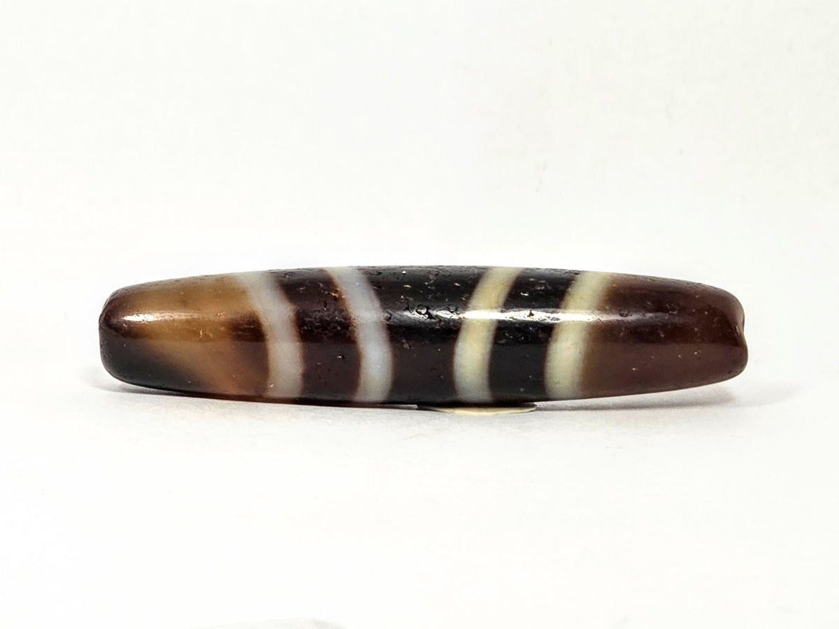 V-052222-7SChung, Face B lower profile, warm chocolate-brown ground, cream-white stripes diagonal wrap, unretouched
