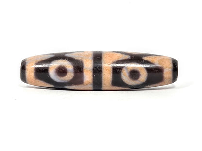 V-061026-6ETTBS face C, warm cinnabar-peach field, white-cream eye rings, tiger tooth chevrons, unretouched