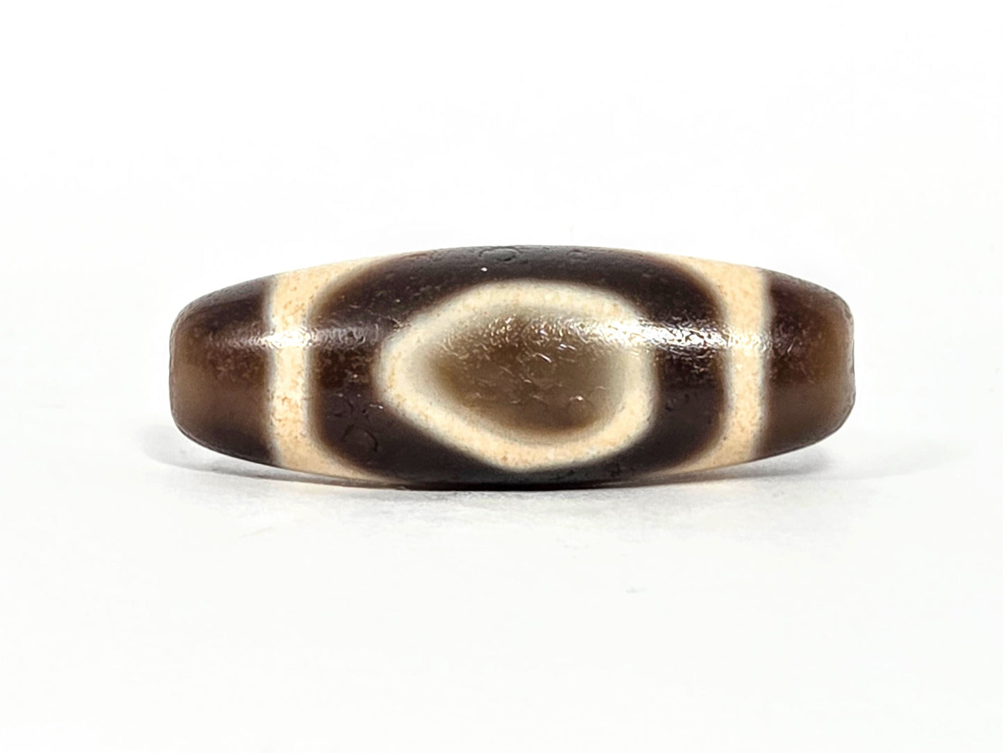 V-071126-HE primary face A, Heaven Earth teardrop oval, vintage Taiwan dzi 38.2×13.4mm, warm dark brown, 1980s, unretouched