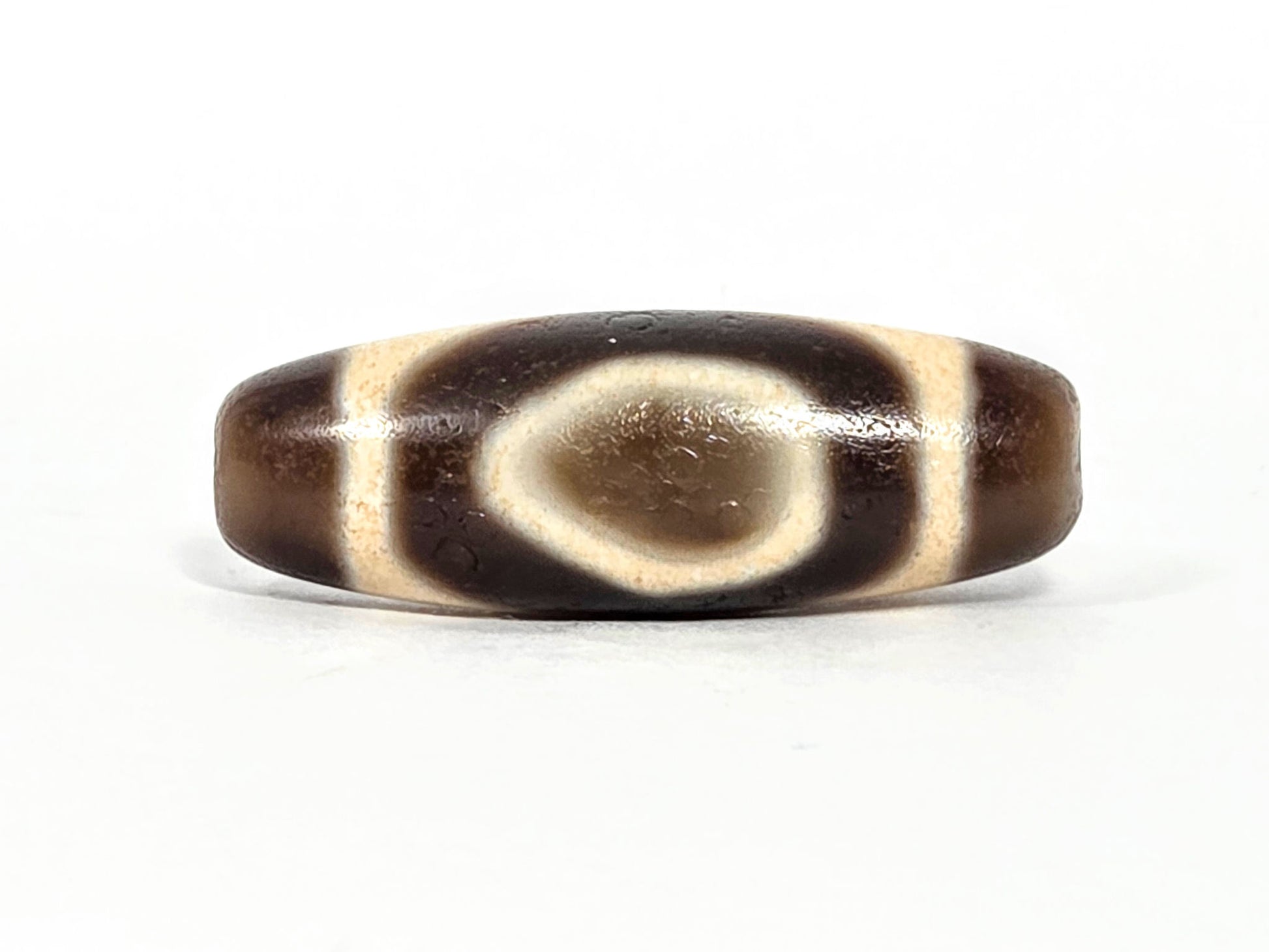V-071126-HE primary face A, Heaven Earth teardrop oval, vintage Taiwan dzi 38.2×13.4mm, warm dark brown, 1980s, unretouched