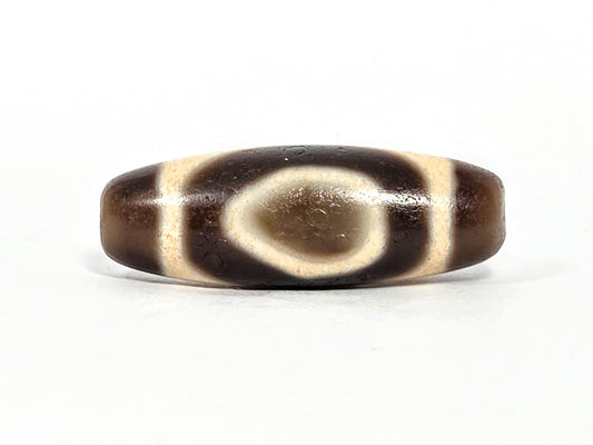 V-071126-HE primary face A, Heaven Earth teardrop oval, vintage Taiwan dzi 38.2×13.4mm, warm dark brown, 1980s, unretouched